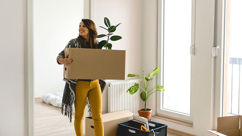 A woman moving into a new home